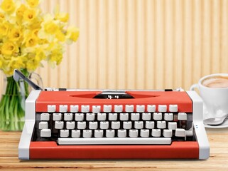 Retro typewriter by bright fresh flowers
