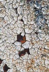 Cracked paint on old metal. Old man. Rust.