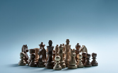 Group of mixed chess pieces standing together