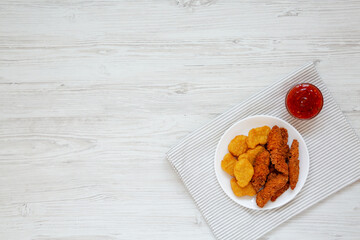 Homemade Nuggets and Chicken Tenders with Sweet and Sour Sauce, top view. Overhead, from above, flat lay. Copy space.