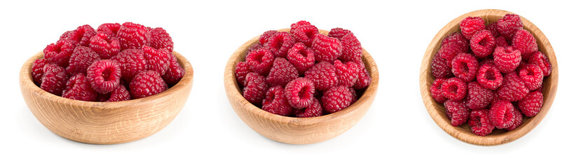 ripe raspberries in wooden bowl isolated on white background. clipping path