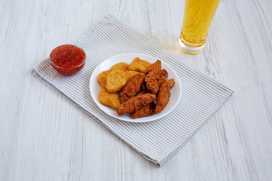 Homemade Nuggets And Chicken Tenders With Sauce And Beer, Low Angle View.