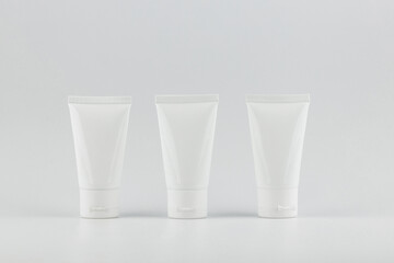 Unbranded plastic tubes for cosmetics products mockup. Skincare and cosmetology branding identity template for text and design