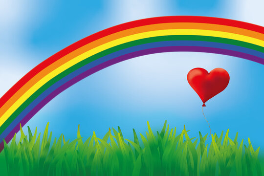 Ein Herzluftballon fliegt &uuml;ber die Wiese unter einem Regenbogen.