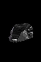 The Obsidian, volcanic glass on a black background.