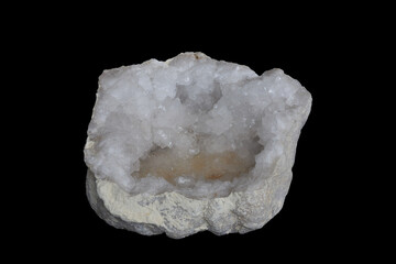 Druse of quartz crystal, translucent mineral stone on black background.