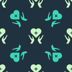 Green and beige Heart with a cross icon isolated seamless pattern on blue background. First aid. Healthcare, medical and pharmacy sign. Vector