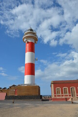 Beautiful lighthouse and fishing museum in the wonderful bay filled with volcanic stones in Bajo Ballena. El Cotillo La Oliva Fuerteventura Canary Islands.