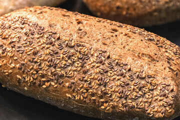 Freshly baked rye bread with sunflower seeds.