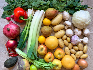 Healthy eating grocery shopping or delivery of fresh fruits and vegetables. Rich vitamin vegetables. Healthy lifestyle, vegan, vegetarian diet, nutrition. Variety of fruits vegetables on craft paper