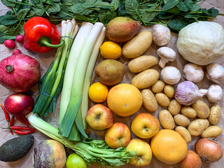 Healthy eating grocery shopping or delivery of fresh fruits and vegetables. Rich vitamin vegetables. Healthy lifestyle, vegan, vegetarian diet, nutrition. Variety of fruits vegetables on craft paper