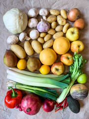 Healthy eating grocery shopping or delivery of fresh fruits and vegetables. Rich vitamin vegetables. Healthy lifestyle, vegan, vegetarian diet, nutrition. Variety of fruits vegetables on craft paper
