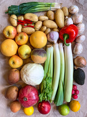 Healthy eating grocery shopping or delivery of fresh fruits and vegetables. Rich vitamin vegetables. Healthy lifestyle, vegan, vegetarian diet, nutrition. Variety of fruits vegetables on craft paper