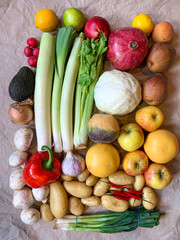 Healthy eating grocery shopping or delivery of fresh fruits and vegetables. Rich vitamin vegetables. Healthy lifestyle, vegan, vegetarian diet, nutrition. Variety of fruits vegetables on craft paper