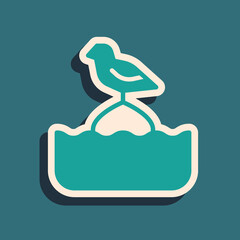 Green Seagull sits on a buoy in the sea icon isolated on green background. Long shadow style. Vector