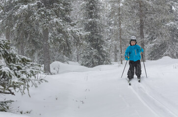 Fototapeta na wymiar Young cross country skier in forest, Sweden.