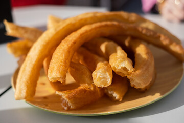 Typical serving of churros in Andalusia, Spain. selective focus