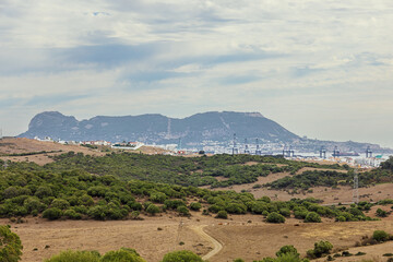 The hinterland of Algeciras with the harhor installations in a distance and Gibraltar in the...