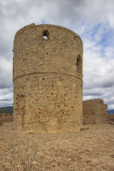 Naklejka premium Close up of a watchtower in the castle of Jimena de la Frontera situated on the outskirts of the village