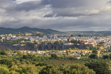 Fototapeta premium Ronda waking up after a rainy night, seen from an outlook south of the city