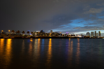 Obraz premium Miami night. Miami city skyline panorama with urban skyscrapers over sea with reflection.