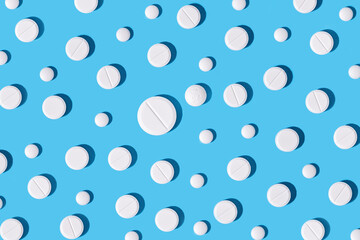 Medical pills on blue background