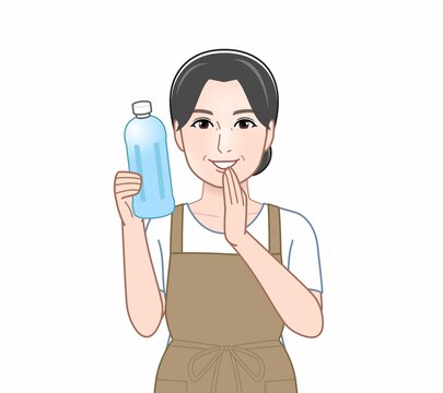 透明のペットボトルを持った女性