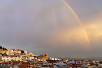 Rainbow over the city of lisbon at sunset from the viewpoint of the elevator of Santa Justa. Portugal.