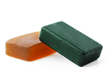Beige and green soap bars on white background