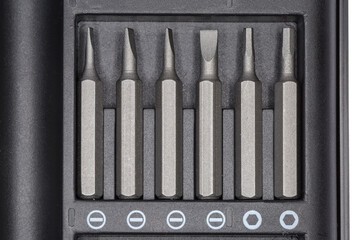 Set of different interchangeable bits for screwdriver in case, top view