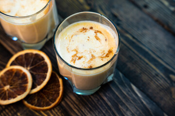Yellow Indian mango yoghurt drink Mango Lassi or smoothie with turmeric and saffron.