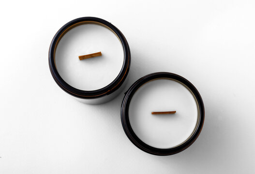 candles in dark glass candlesticks on a white background. insulation.