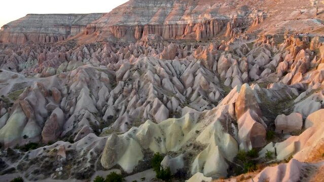 Colored red and green rocky terrain in rose valley in cappadocia, turkey