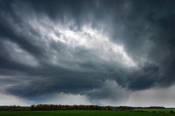 Fototapeta na wymiar Thunder storm clouds with supercell wall cloud, summer, Lithuania