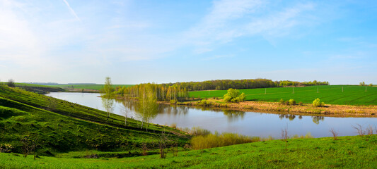 Spring landscape with river and fields