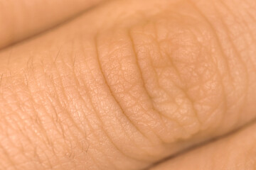 Human fingers skin texture. Detail healthy skin background. Young person, healthcare concept photo