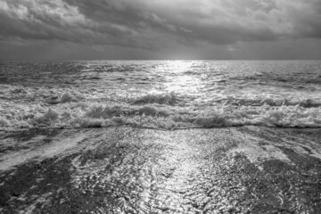 Black and white stock photography of beautiful cloudy stormy sunny sea landscape