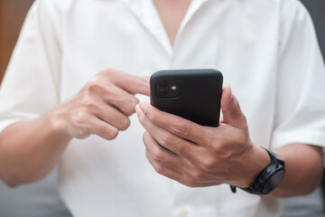 Man using smartphone for social media, young male texting messages by mobile phone. technology, network, online shopping, e commerce, lifestyle and digital communication concept