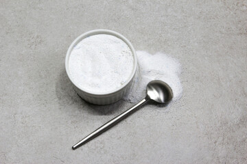 Collagen powder on grey background. Natural health supplement for skin