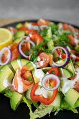 Vegetable salad with smoked salmon and fresh vegetables.