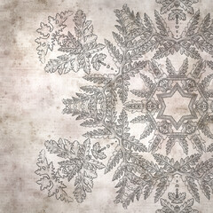 Obraz premium stylish textured old paper background with kaleidoscope snowflake
