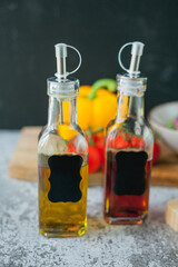 Plate of vegetable and avocado salad, olive oil and wine vinegar in bottles. Healthy food. Vegetarian. Tomatoes and green salad. Organic products. Eco. Home.