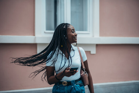 Beautiful african american woman using smartphone