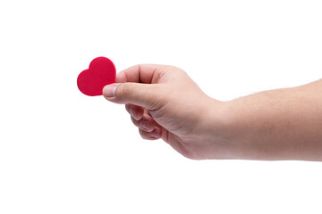 Fototapeta premium A man's hand holds a red heart isolated on a white background.