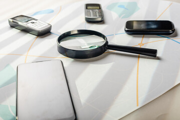 Workplace of private detective with professional equipment for surveillance and spying