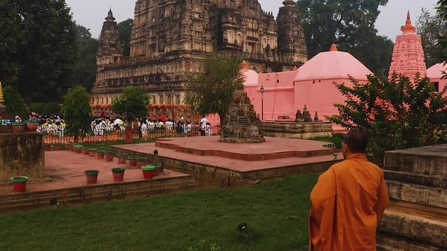 monks offering morning pryers at ancient traditional buddhist temple from different angle