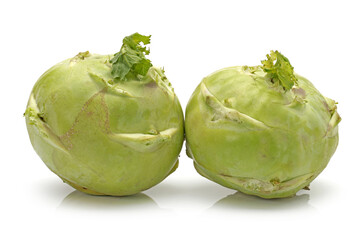 Fresh kohlrabi with green leaves on isolated white backround