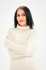 Fototapeta premium Middle aged woman starting getting grey-haired is posing in studio in sweater on white background, face skin care beauty, middle age skincare cosmetics, cosmetology concept
