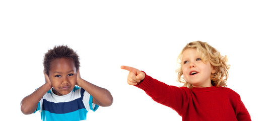 Blond child pointing at another one