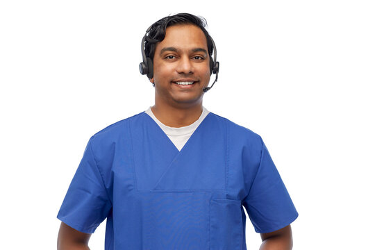 Medicine, Profession And Healthcare Concept - Happy Smiling Indian Doctor Or Male Nurse With Headset Over White Background